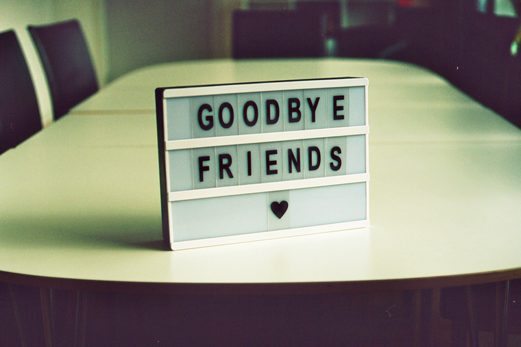 Small sign in conference room, reading 'Goodbye friends'