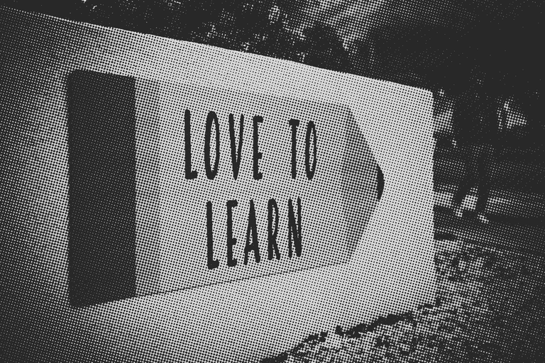 Sign outside a school that says 'Love To Learn'